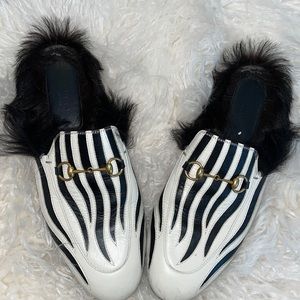 Gucci zebra slip ons
